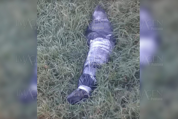 Otro cadáver embolsado, ahora bajo el puente del río Atoyac